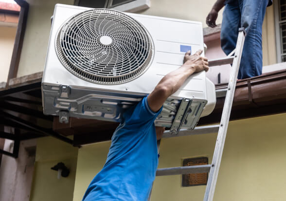 Professional installing the AC